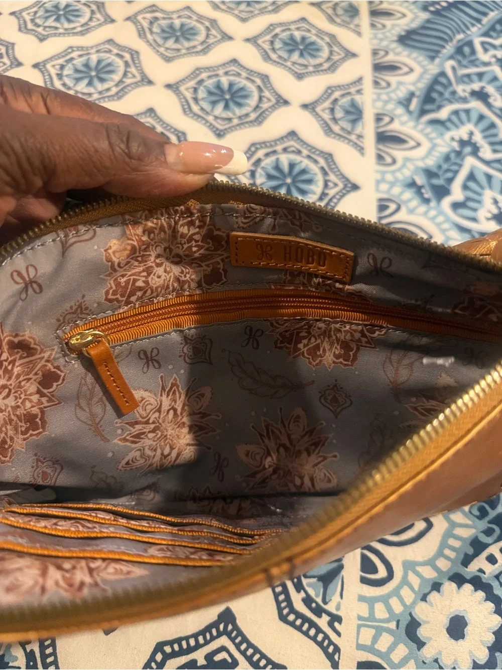 HOBO Metallic Gold Leather Wristlet with Tassel and Ring Handle